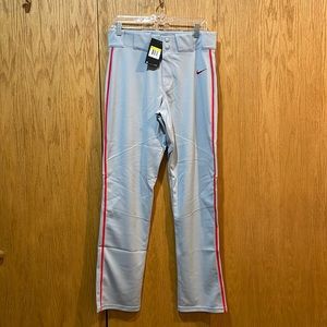 Nike Mens baseball pants.  Gray with red strip down the side. Brand new w/ tags.
